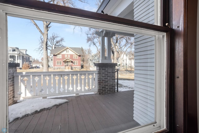 wooden deck featuring a residential view