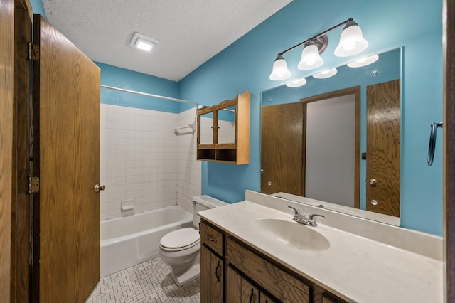 bathroom with bathing tub / shower combination, toilet, a textured ceiling, vanity, and tile patterned flooring