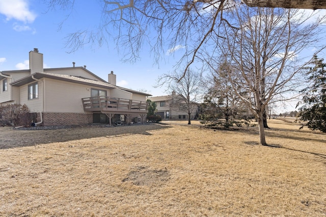 view of yard with a wooden deck