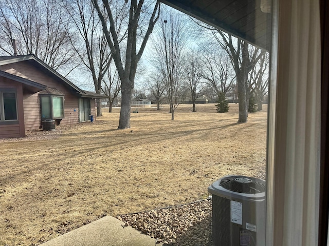 view of yard with central air condition unit