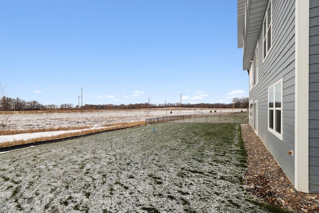 view of yard with a rural view and fence