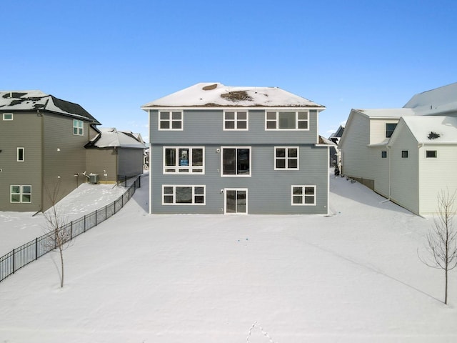 back of house featuring fence