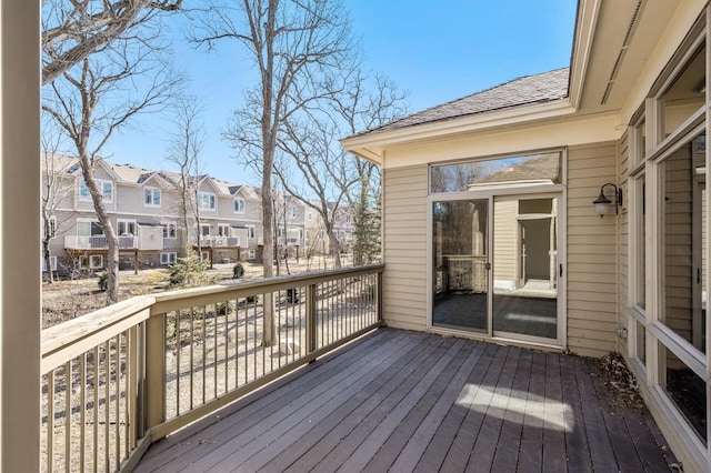 wooden terrace with a residential view