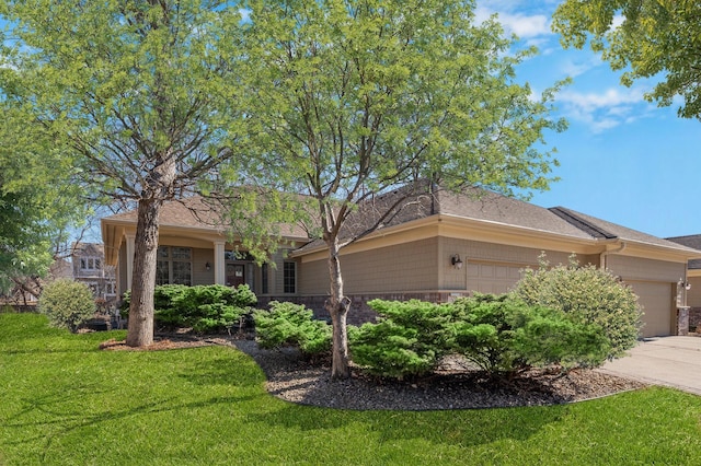 single story home with driveway, a front lawn, and a garage