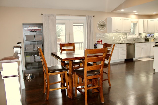 dining area with dark wood-style floors, recessed lighting, and french doors