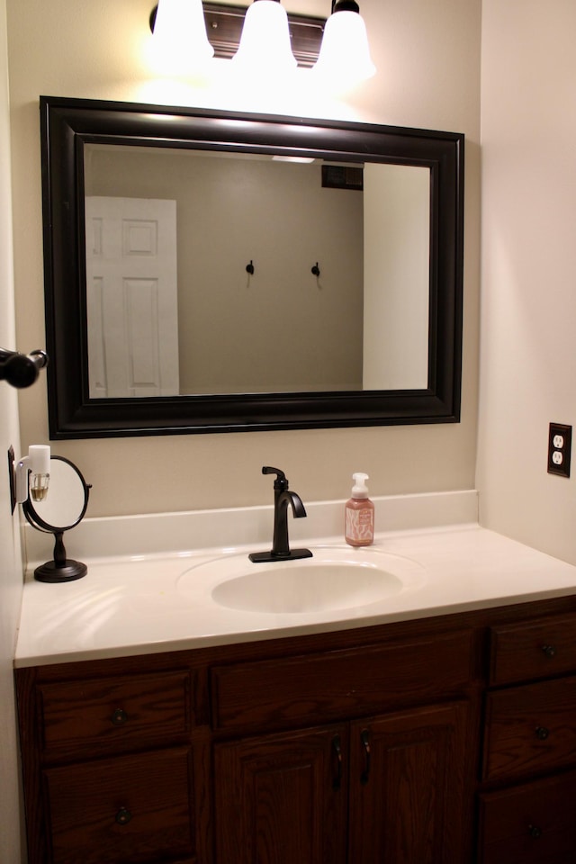 bathroom featuring visible vents and vanity