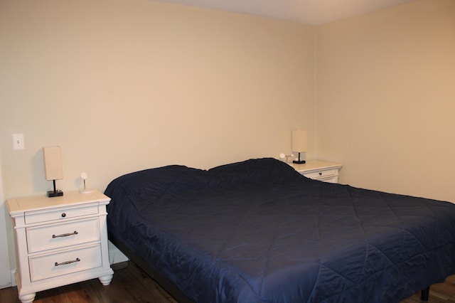 bedroom featuring dark wood-type flooring