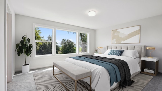 carpeted bedroom with baseboards