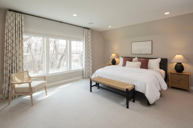 bedroom with light colored carpet, baseboards, and recessed lighting