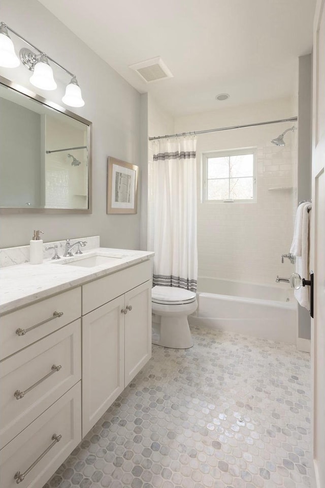full bathroom featuring toilet, shower / tub combo, tile patterned floors, and vanity