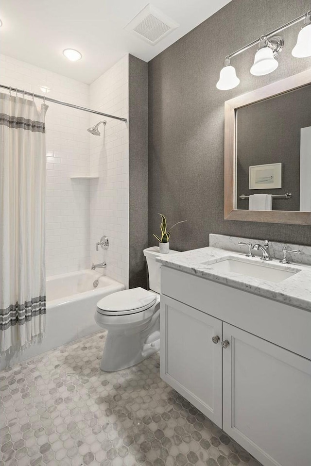 bathroom with toilet, vanity, and shower / bathtub combination with curtain