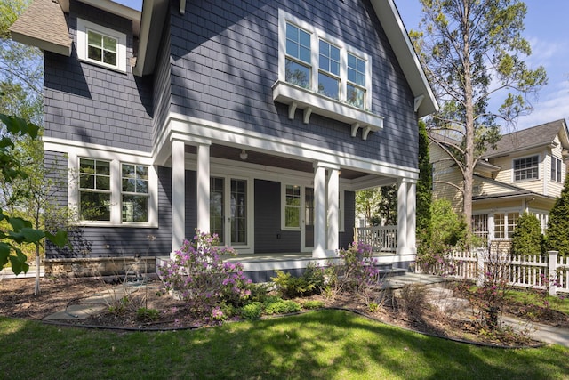 rear view of property featuring a porch