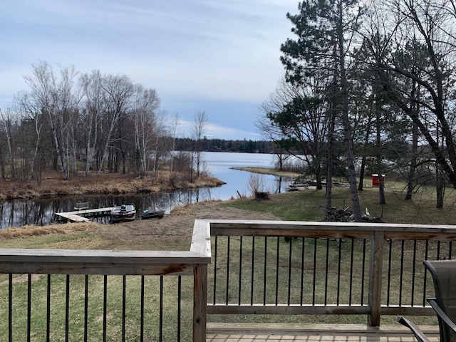 deck featuring a yard and a water view