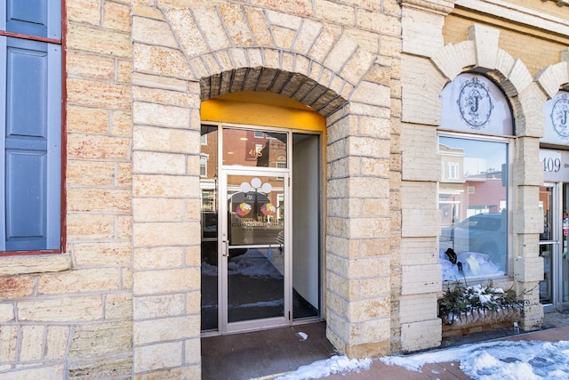 entrance to property with stone siding