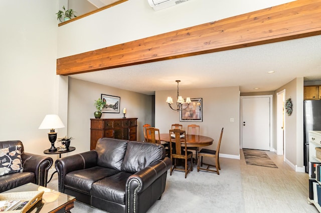 living room with a chandelier, beamed ceiling, visible vents, and baseboards