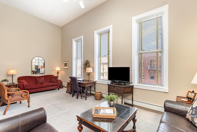 carpeted living area featuring a baseboard heating unit