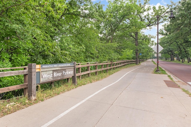 view of property's community featuring fence