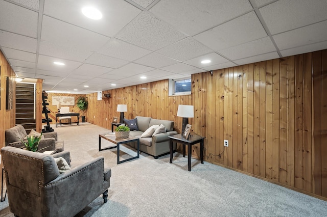 living area with carpet, wood walls, stairway, and recessed lighting