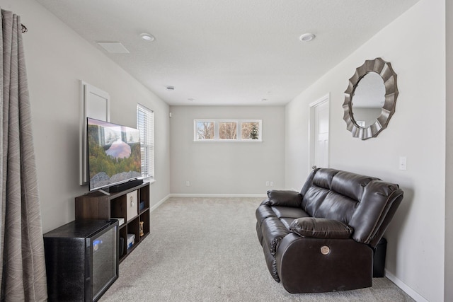 living room featuring carpet flooring and baseboards