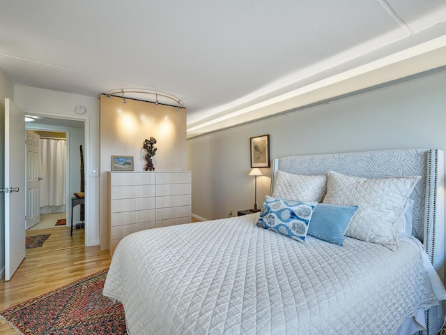 bedroom featuring wood finished floors