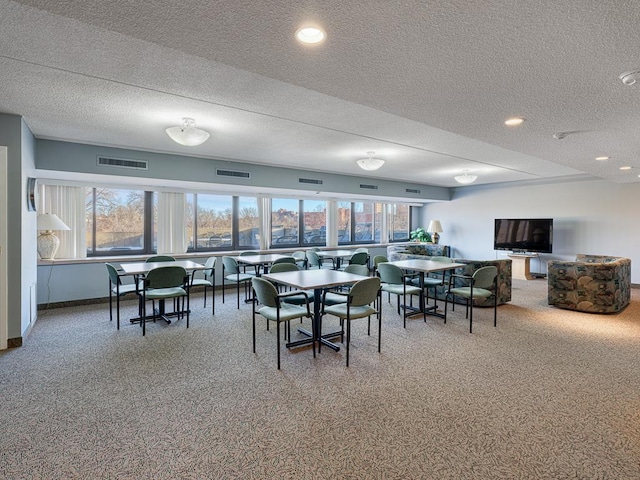 dining space with baseboards, visible vents, and carpet flooring