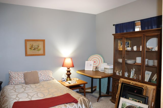 carpeted bedroom with baseboards