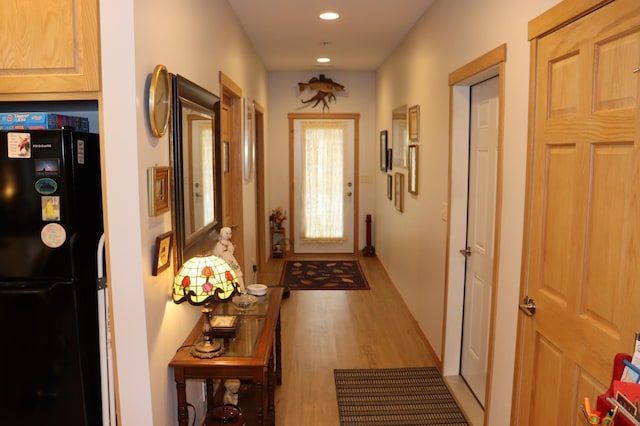 doorway with recessed lighting and light wood-type flooring