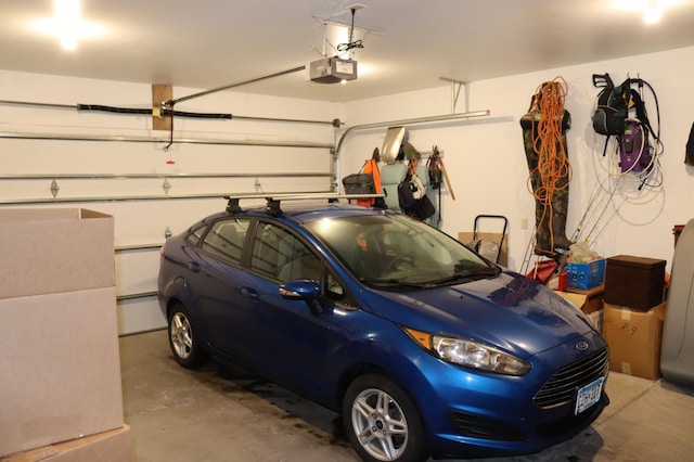 garage featuring a garage door opener