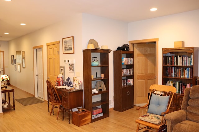 218 Thomas Dr, Rollingstone, MN 55969 - sitting room featuring wood finished floors and recessed lighting