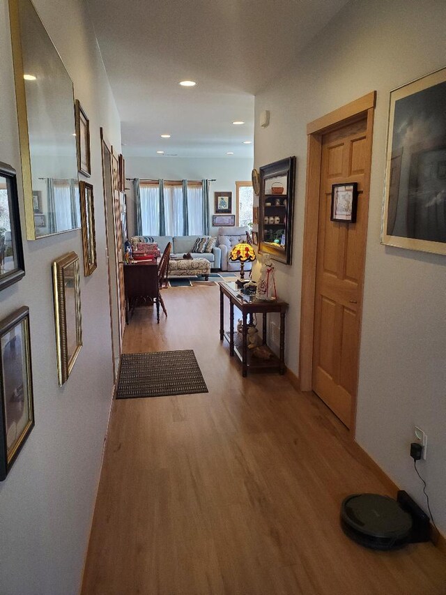 218 Thomas Dr, Rollingstone, MN 55969 - hallway featuring wood finished floors, recessed lighting, and baseboards