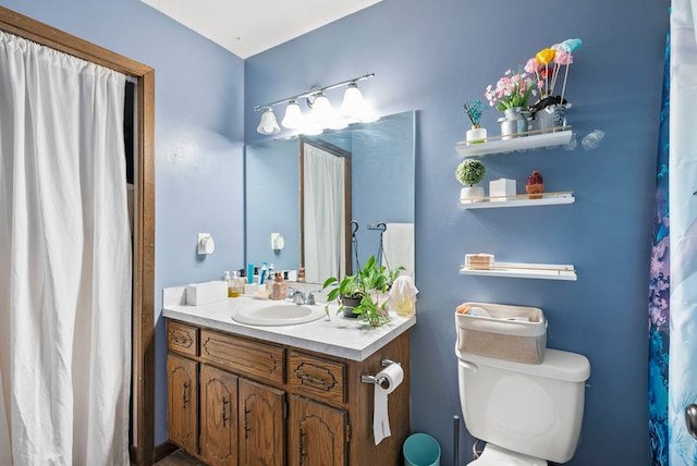 bathroom with toilet and vanity