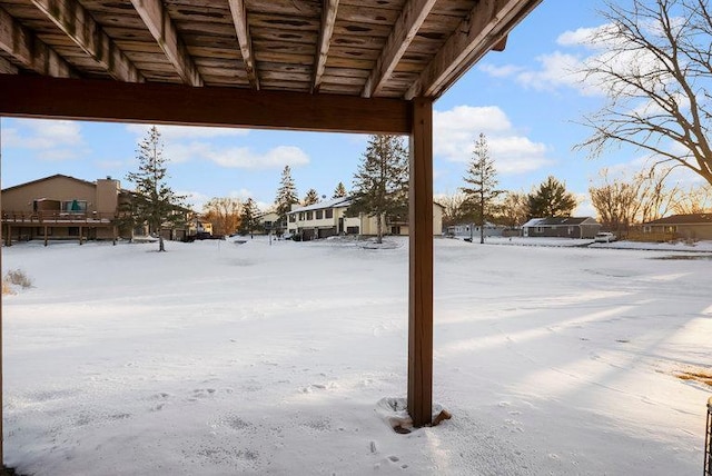 view of yard covered in snow