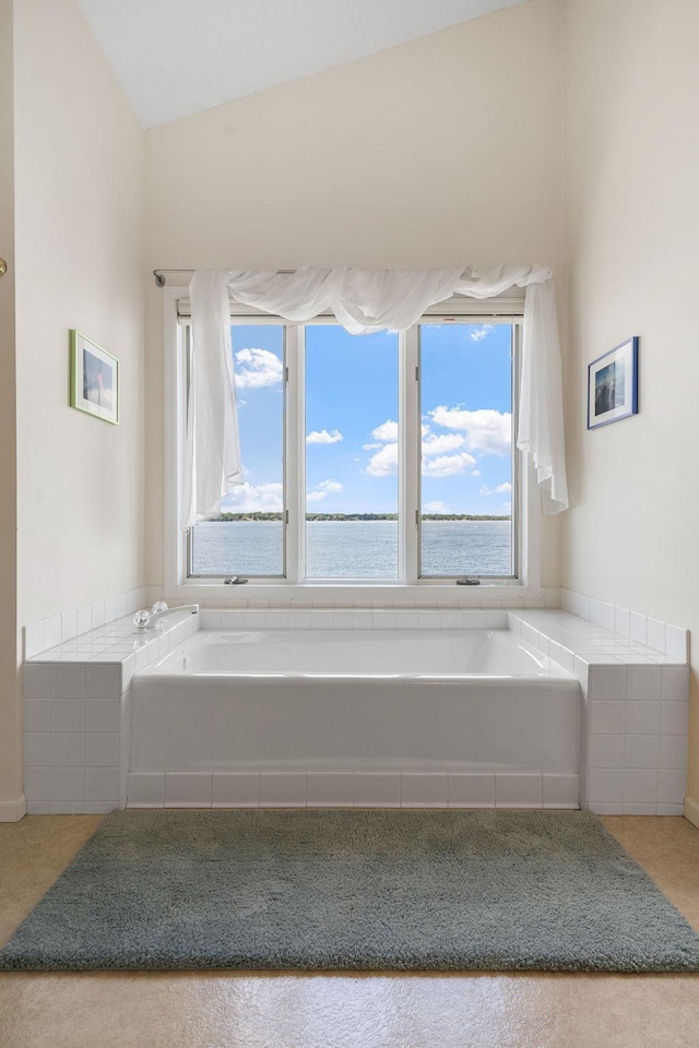 bathroom with a garden tub