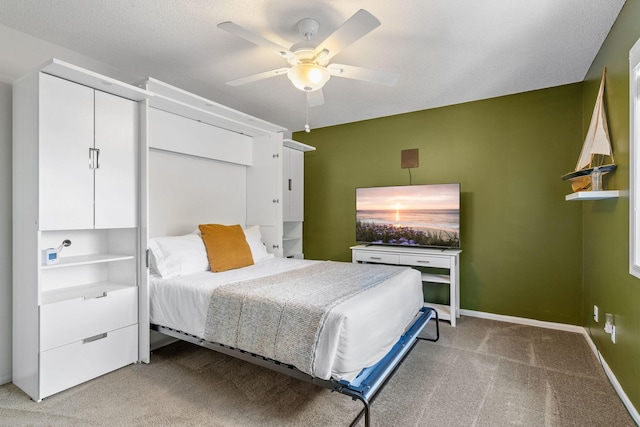 bedroom featuring ceiling fan, carpet, and baseboards