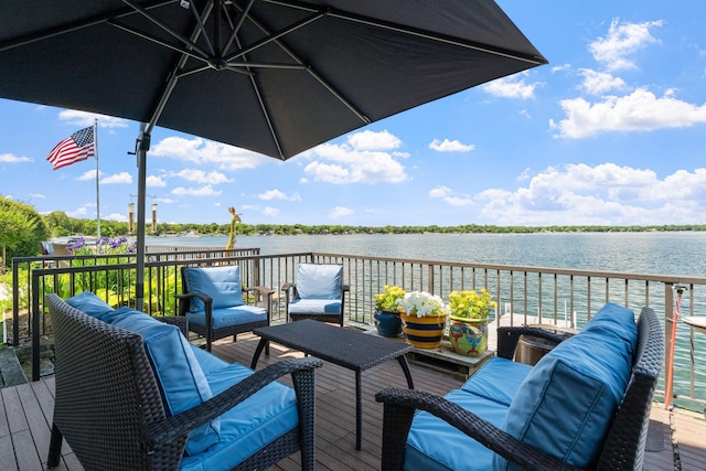 deck featuring a water view and an outdoor living space