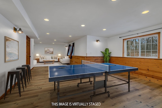 playroom featuring recessed lighting, wainscoting, wood walls, and wood finished floors