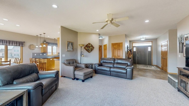 living room with recessed lighting, baseboards, light carpet, and a ceiling fan