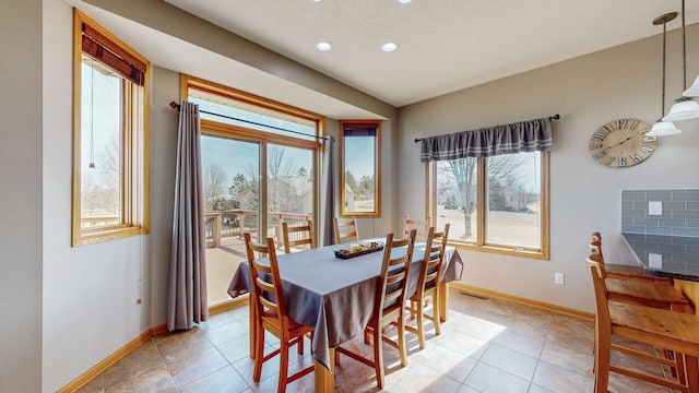 dining area with light tile patterned floors, recessed lighting, and baseboards