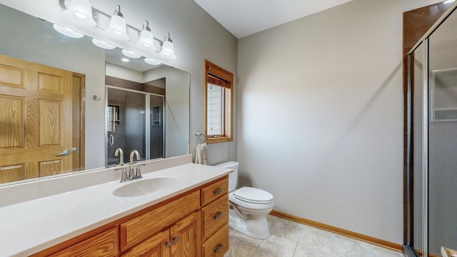 full bathroom with baseboards, toilet, a stall shower, tile patterned floors, and vanity