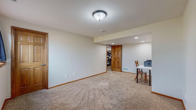 carpeted office featuring recessed lighting, baseboards, and visible vents