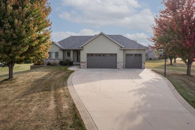 ranch-style home with a front lawn, an attached garage, concrete driveway, and roof with shingles