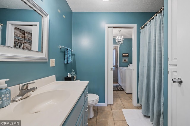 bathroom featuring toilet, independent washer and dryer, tile patterned flooring, a textured ceiling, and vanity