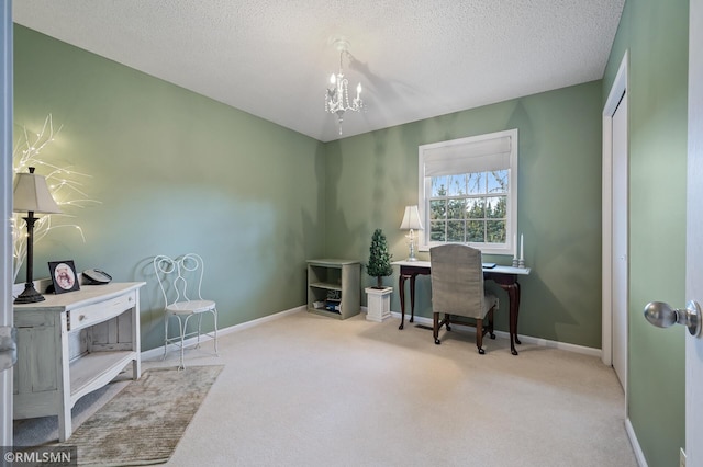 home office featuring carpet, baseboards, a chandelier, and a textured ceiling