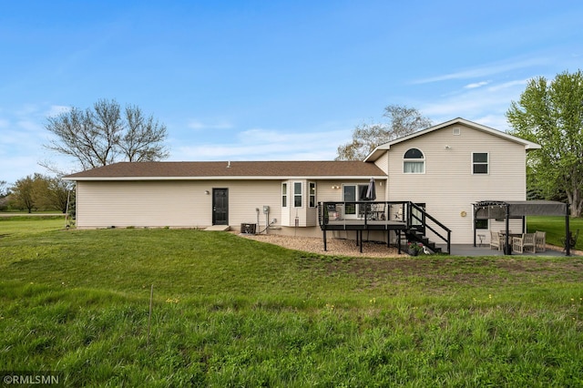 rear view of property featuring stairs, a patio area, cooling unit, a deck, and a lawn