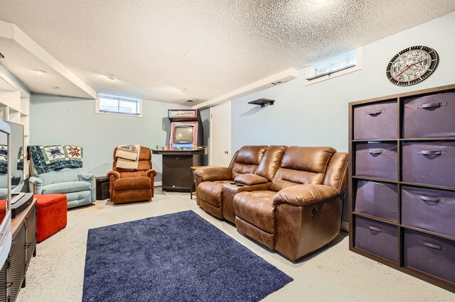 living area featuring a textured ceiling