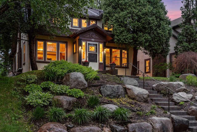 1286 Fairmount Ave, Saint Paul, MN 55105 - view of front of property with stairway, stucco siding, and covered porch