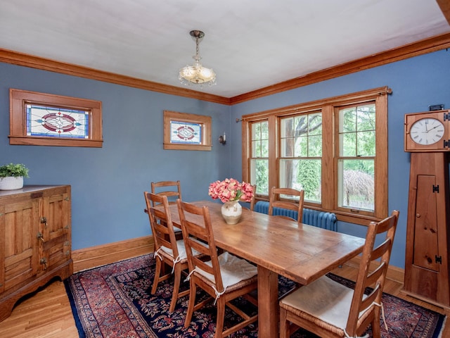 1286 Fairmount Ave, Saint Paul, MN 55105 - dining space featuring light wood-style floors, baseboards, and crown molding