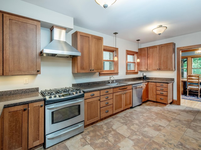 1286 Fairmount Ave, Saint Paul, MN 55105 - kitchen with wall chimney range hood, appliances with stainless steel finishes, dark countertops, a sink, and brown cabinetry