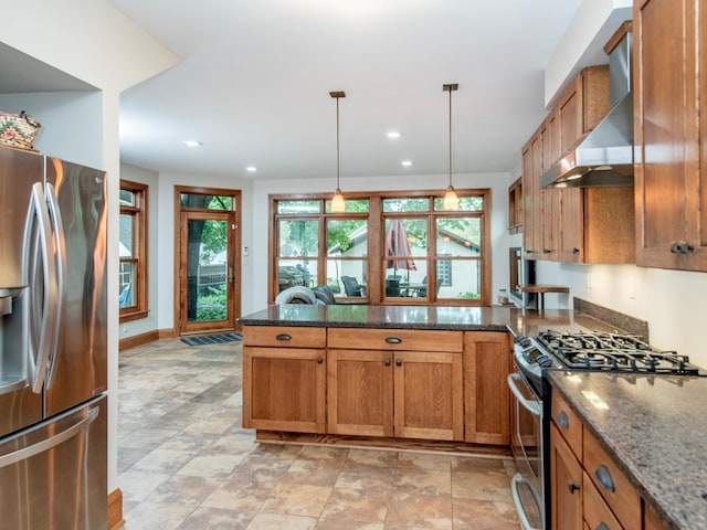 1286 Fairmount Ave, Saint Paul, MN 55105 - kitchen featuring appliances with stainless steel finishes, wall chimney exhaust hood, brown cabinets, a peninsula, and recessed lighting