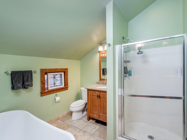 1286 Fairmount Ave, Saint Paul, MN 55105 - full bathroom featuring vaulted ceiling, a shower stall, a freestanding tub, vanity, and toilet